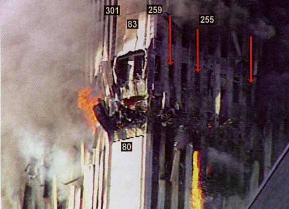 Figure 64. Aluminum cladding and debris on ground exhibiting glow without burning adjacent materials, showing non-incandescent luminosity